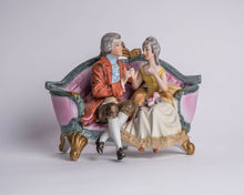 BISQUE COLONIAL COUPLE ON COUCH