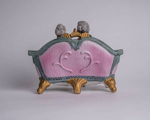 BISQUE COLONIAL COUPLE ON COUCH