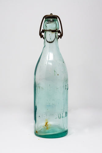 VINTAGE 9 1/2 INCH GREEN GLASS BOTTLE WITH UNUSUAL SWING TOP METAL STOPPER